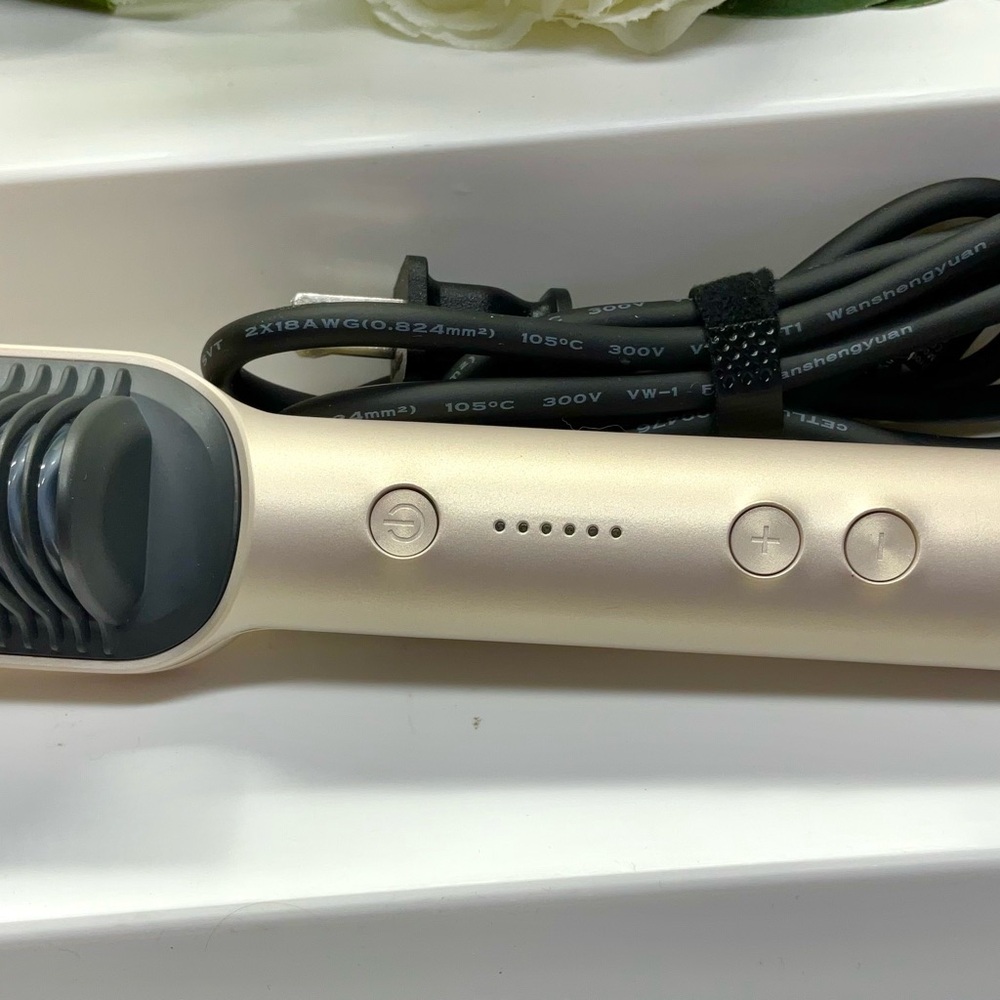 Sleek Cream Hair Styling Tool